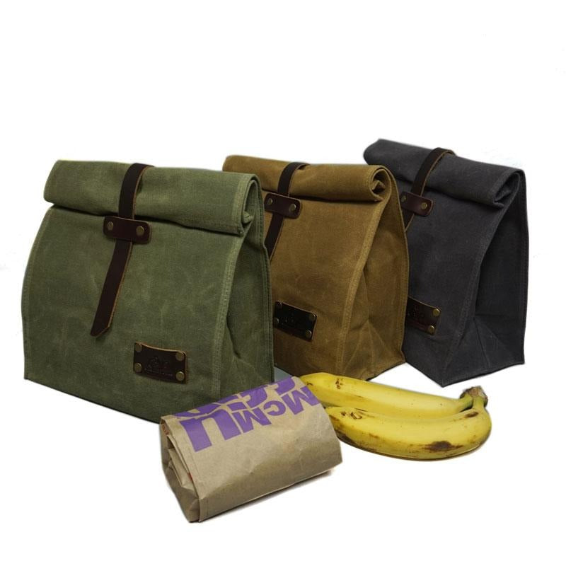 3 Waxed Canvas Leather Lunch Bags next to a bannana