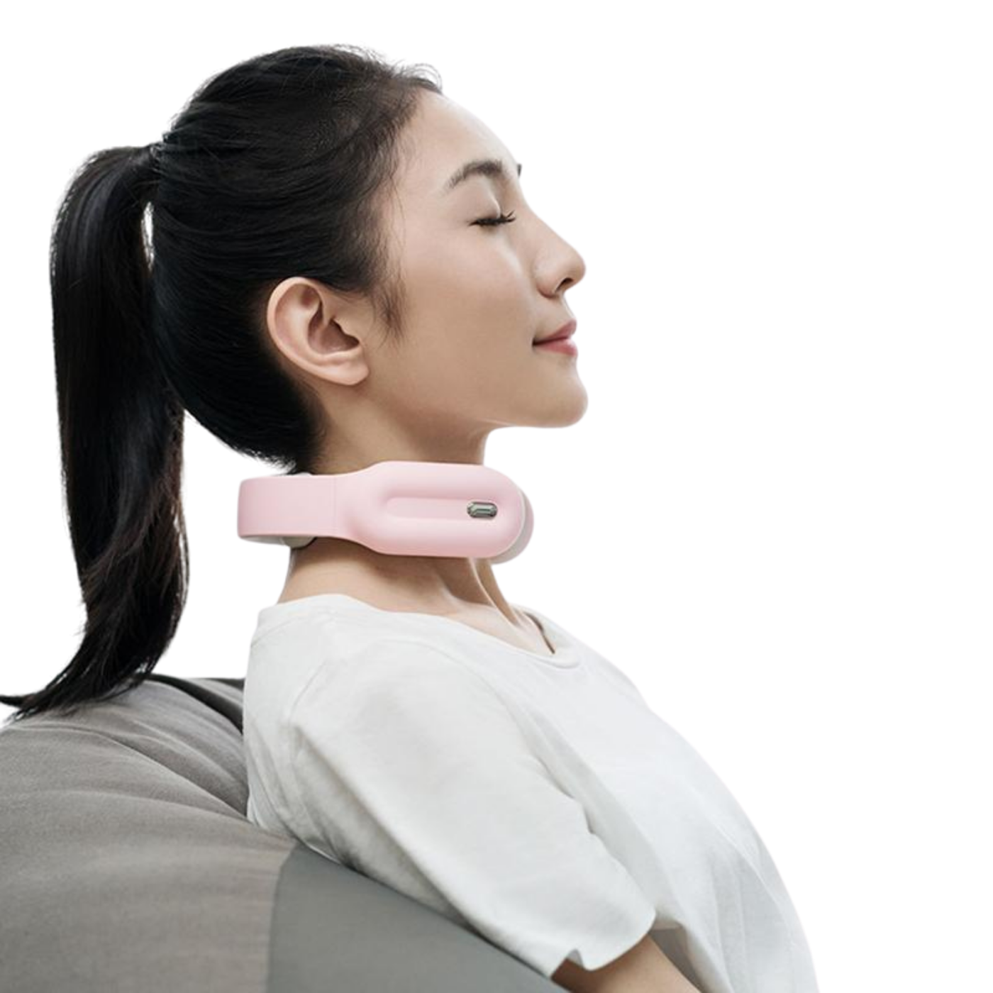 young lady relaxed sitting down while using pink Physiotherapy Neck & Shoulder Massager
