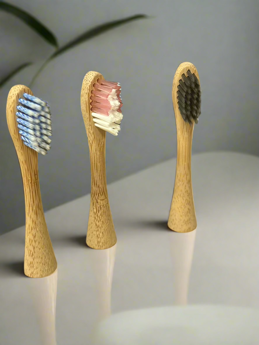 Eco-friendly bamboo toothbrush heads showcasing natural wooden grain and soft bristles for sustainable dental care.