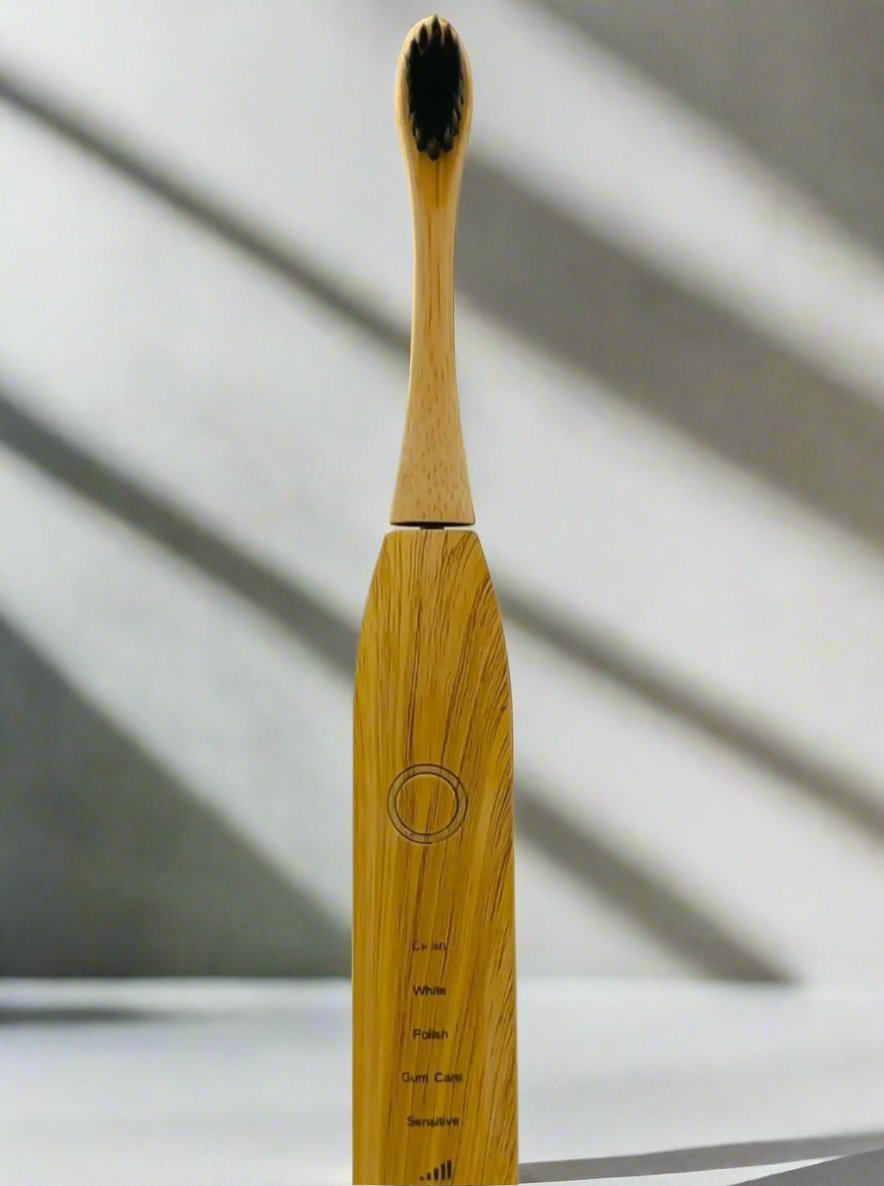 Electric toothbrush with a bamboo brush head, blending modern technology and sustainable design for eco-conscious oral hygiene